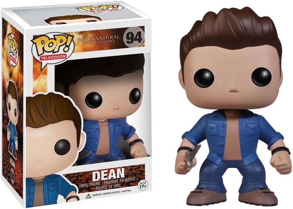 A vinyl Funko Pop figure of the character Dean Winchester from the TV series "Supernatural." The figure is in blue jeans and a blue denim shirt, and is carrying a knife in one hand. Next to the figure is the cardboard Funko Pop! box is comes with.