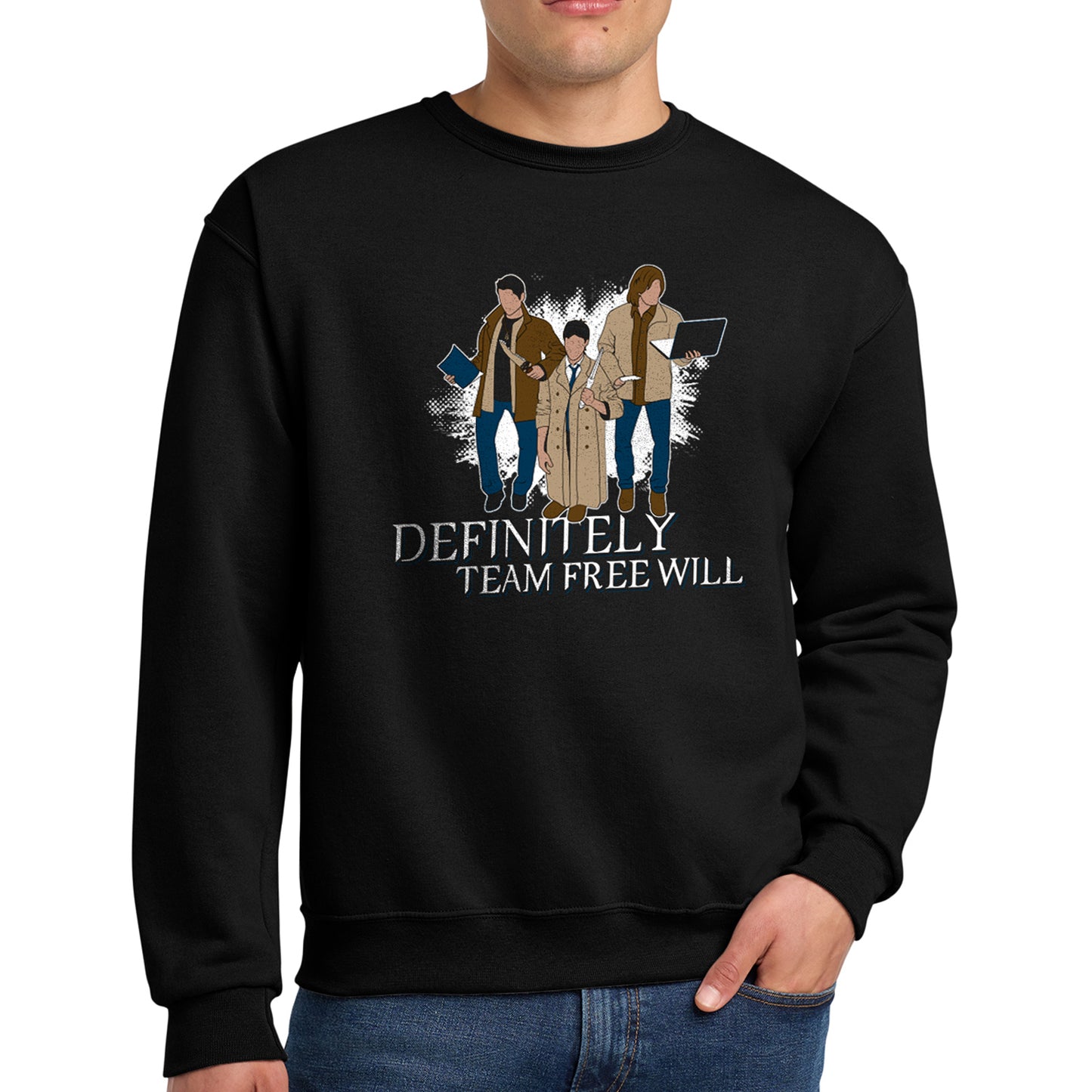 A male model in a black sweatshirt against a white background. On the shirt is the famous behind the scenes picture of Misha, Jared, and Jensen trading their characters's outfits. White text underneath says "Definitely Team Free Will."