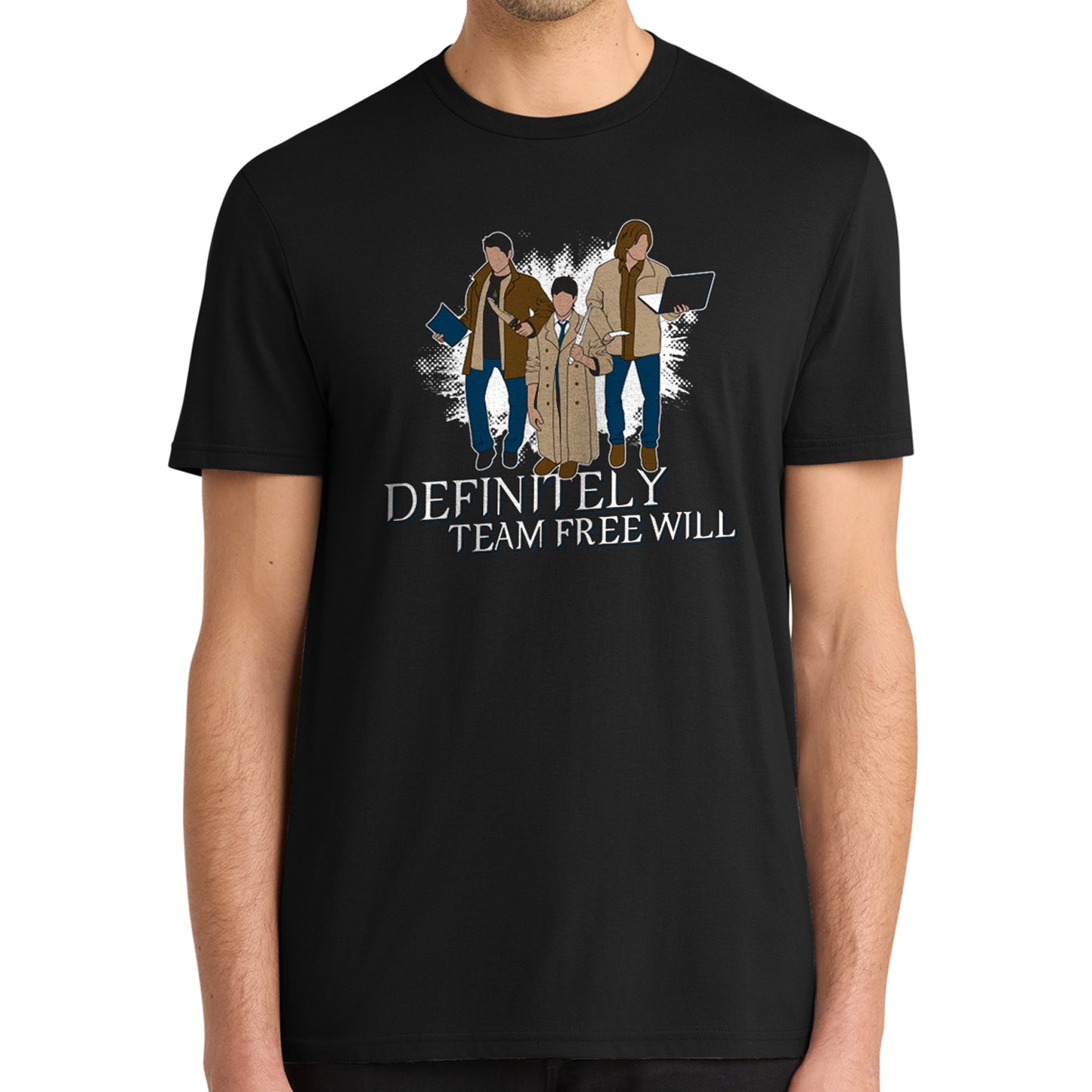 A model in a black tee shirt against a white background. On the shirt is the famous behind the scenes picture of Misha, Jared, and Jensen trading their characters's outfits. White text underneath says "Definitely Team Free Will."