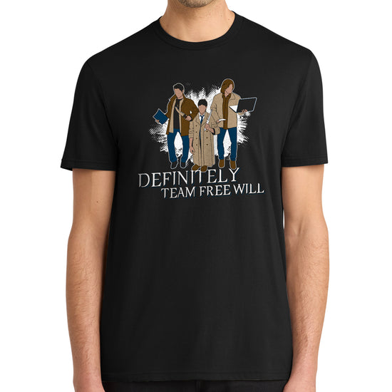 A model in a black tee shirt against a white background. On the shirt is the famous behind the scenes picture of Misha, Jared, and Jensen trading their characters's outfits. White text underneath says "Definitely Team Free Will."