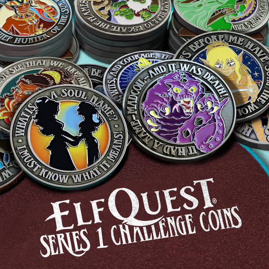 A photo of a series of ElfQuest-themed metal challenge coins laid out/stacked like poker chips. The coins are on a maroon, textured card table that reads "ELFQUEST SERIES 1 CHALLENGE COINS" in white font.