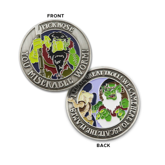Front and back images of a brass challenge coin The front of the coin depicts the ElfQuest character Picknose, with raised text saying "picknose, you miserable worm" around the edge. The back depicts a green troll, with raised text saying "relax you great troll! We came here to escape the flames."