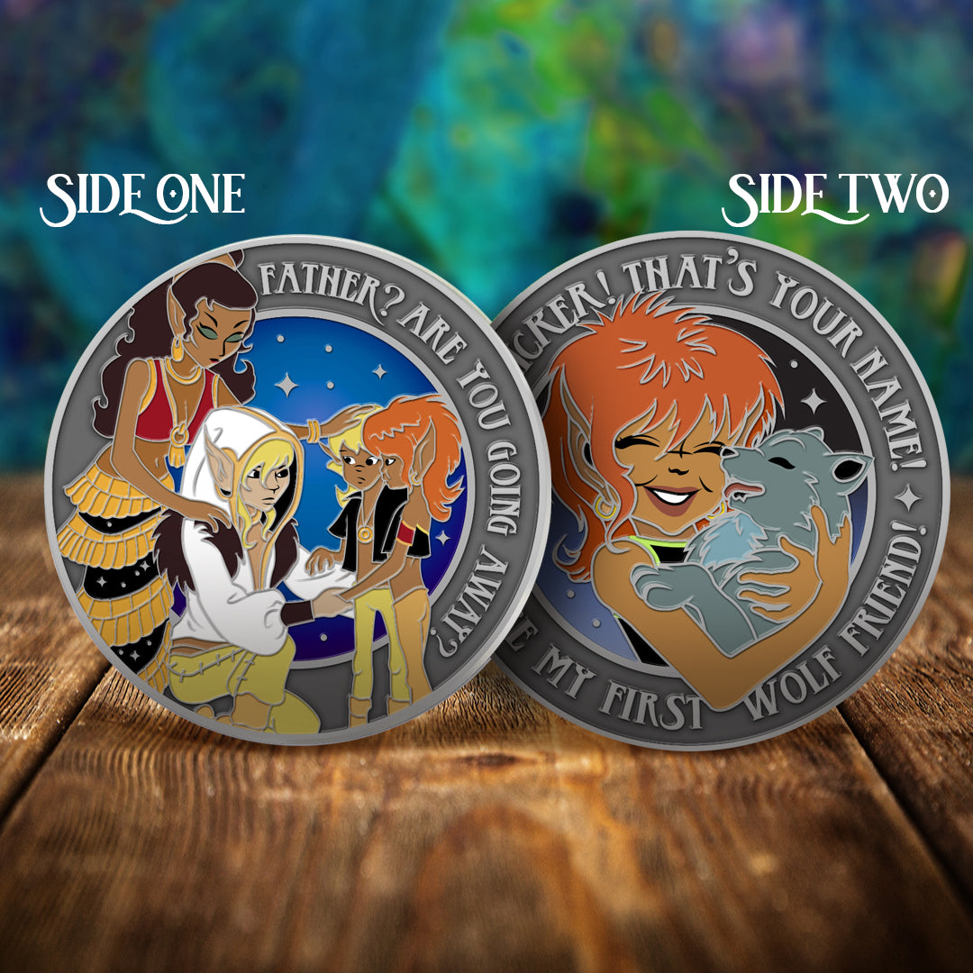 Two challenge coins side by side on a wooden table, with a swirling green and blue pattern in the background. The left coin depicts the ElfQuest characters Leetah, Cutter, Suntop, and Ember, looking together. Text around the edge of the coin says "Father? Are you going away?" The right coin depicts a human with orange hair holding a gray wolf. Text around the edge says "Choplicker! That's your name! You're my first wolf friend."