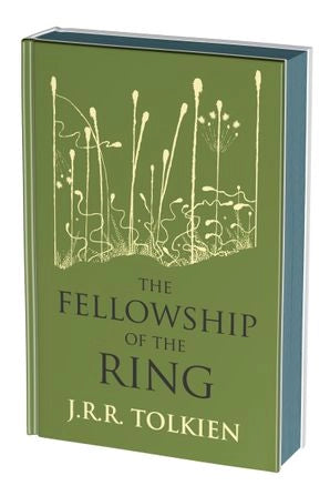 A green hardcover book on a white background. The front cover depicts a minimalist drawing of a swamp in gold. Black text says "The Fellowship of the Rings."