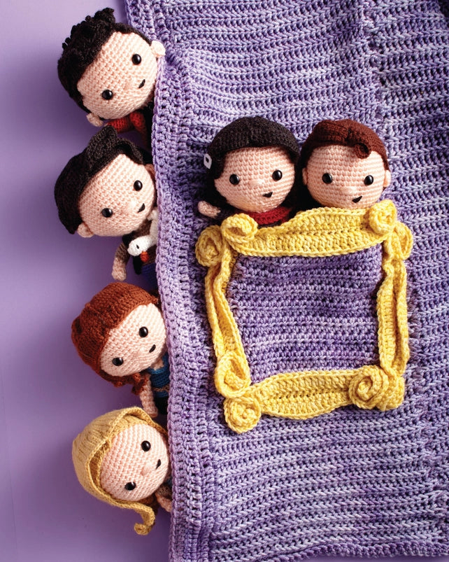 A close up of six crochet figures, depicting the main characters from "Friends." 