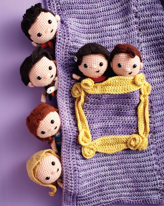 A close up of six crochet figures, depicting the main characters from "Friends." 