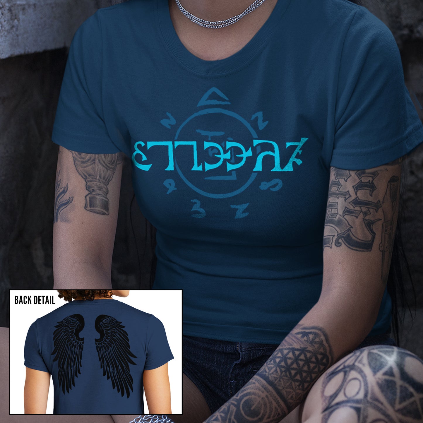 Two images of models wearing a blue t-shirt. The front of the shirt has light blue runes, which spell out the word "funnier" in the angelic language Enochian.  The back of the shirt has a pair of large black angel wings.