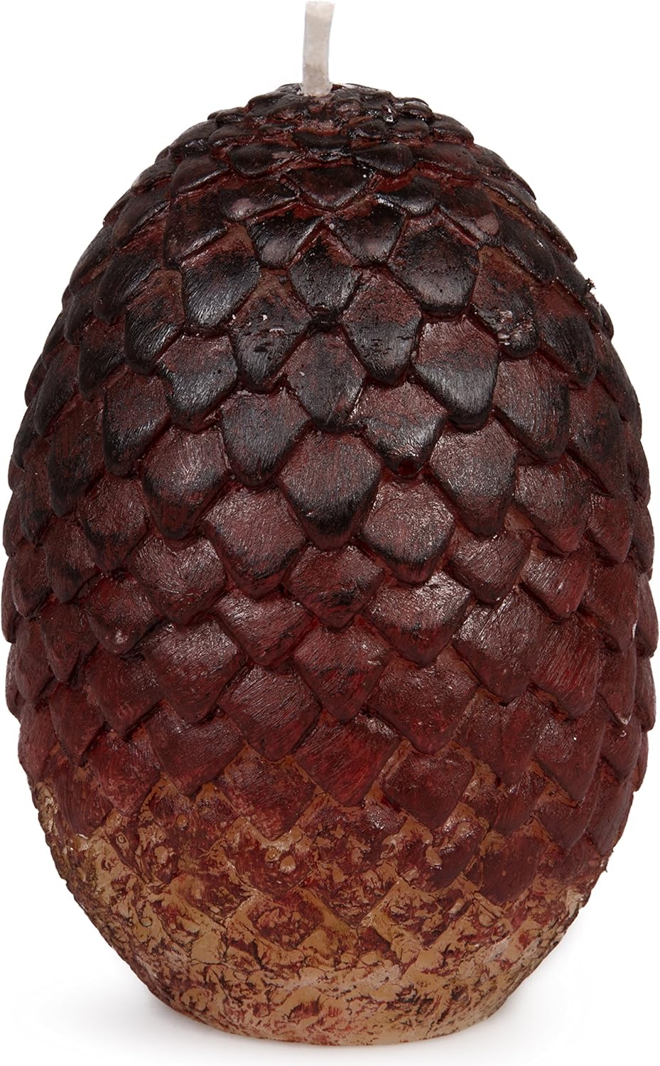 A red, egg-shaped candle with scales around the outside.