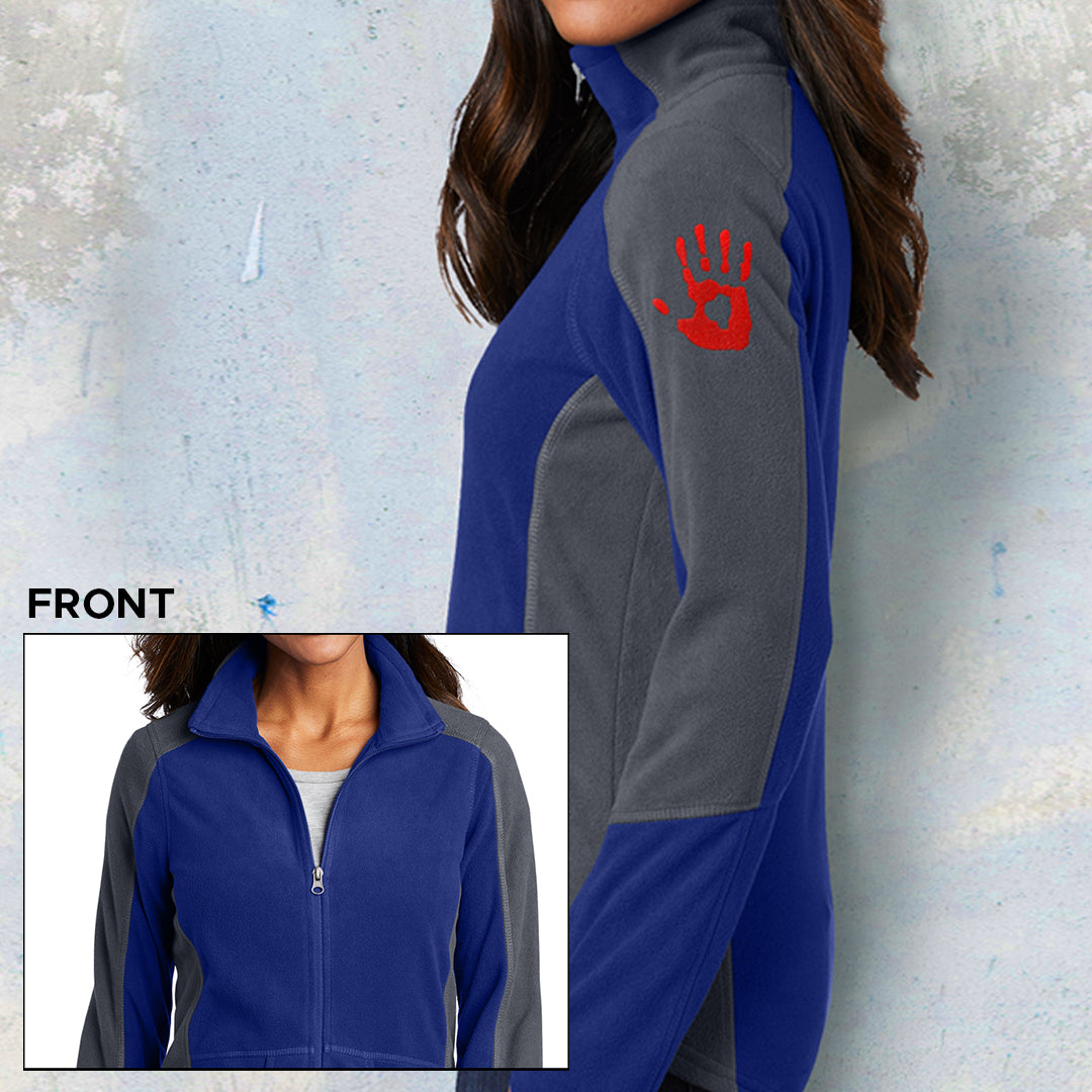 Front and side views of a female model wearing a gray and blue fleece jacket. On the left sleeve there is a red handprint.