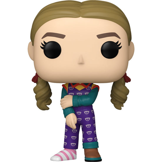 A bobblehead figure depicting Holly Wheeler from the TV series Stranger Things, against a white background. She is wearing a purple jumpsuit, with one brown shoe and one pink and white striped sock.