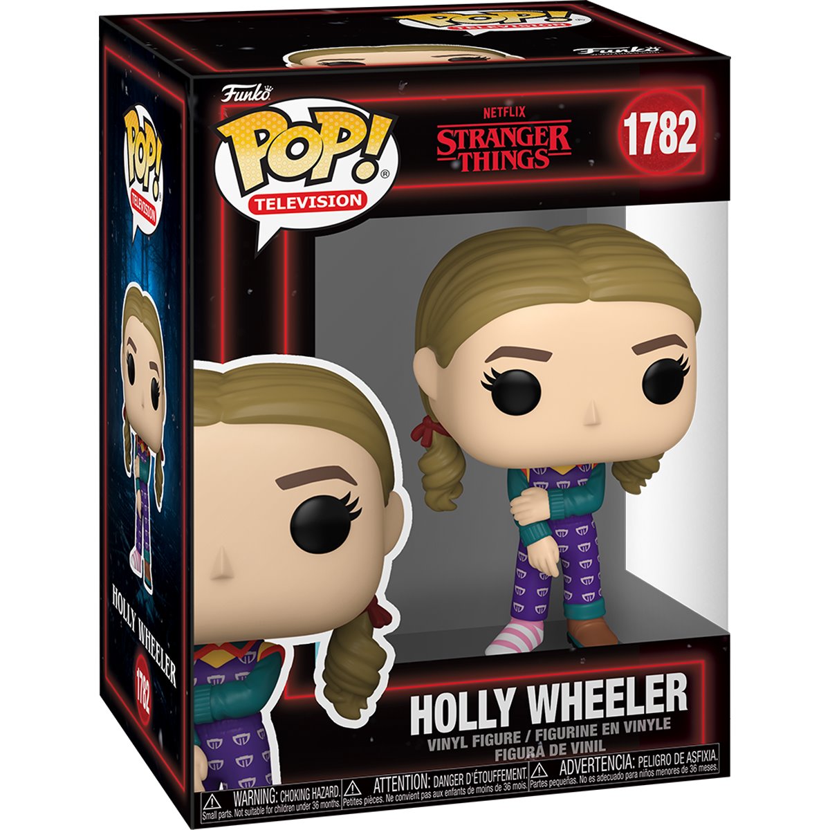 A cardboard box with a transparent front, containing a bobblehead figure depicting Holly Wheeler from the TV series Stranger Things. She is wearing a purple jumpsuit, with one brown shoe and one pink and white striped sock.