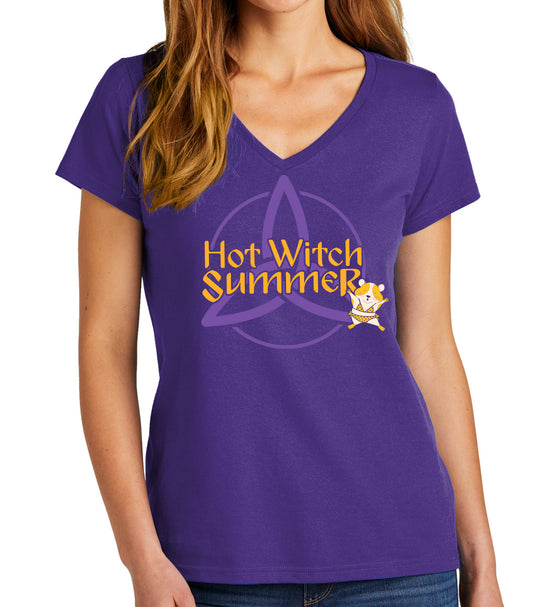 A female model in a purple v-neck shirt. The front of the shirt has yellow text that says "hot witch summer," Next to the text is a cartoon drawing of a hamster in a bikini. In the background is a witch symbol in light purple.