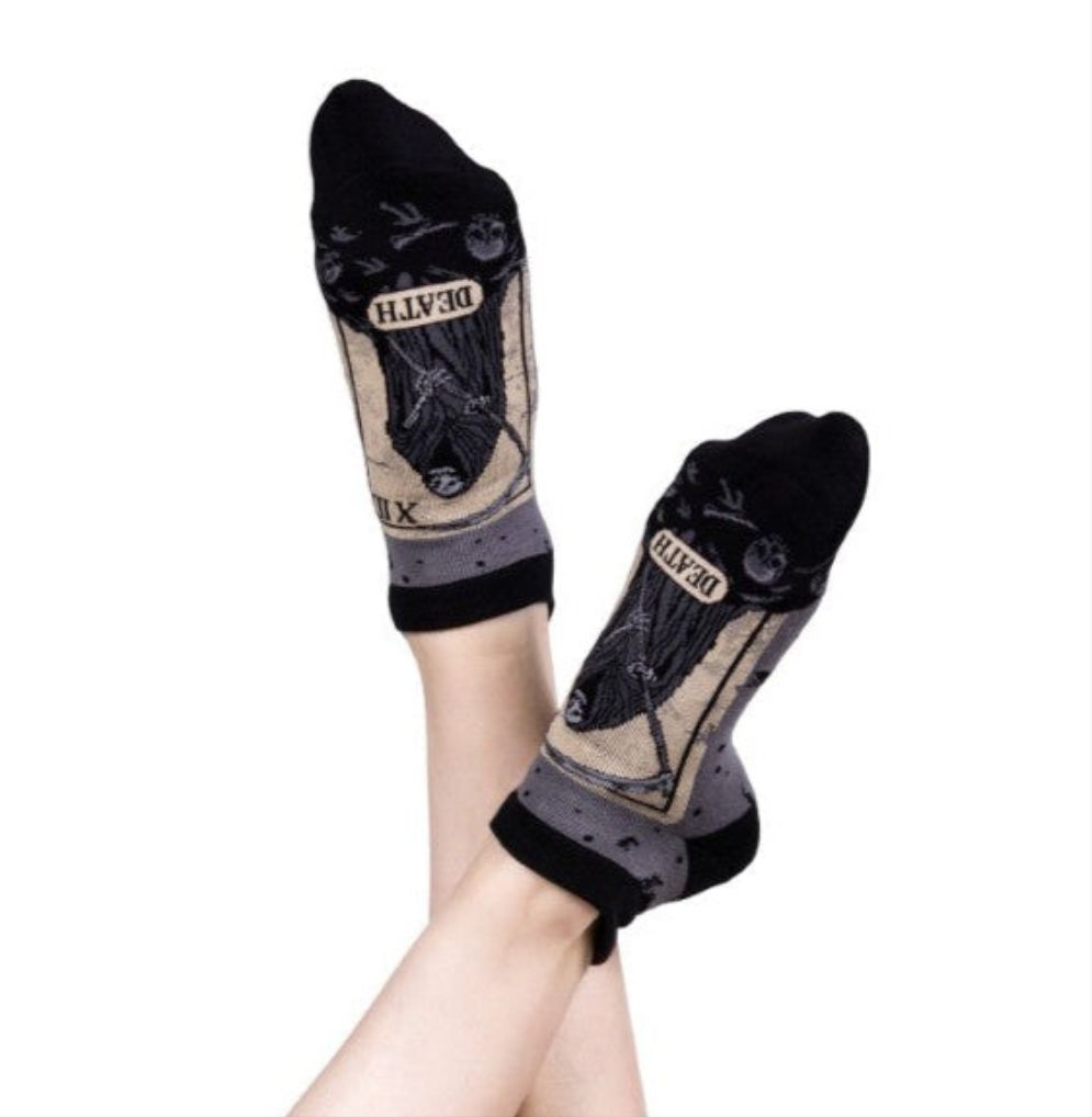 Black and beige socks with 'DEATH' text on a white background