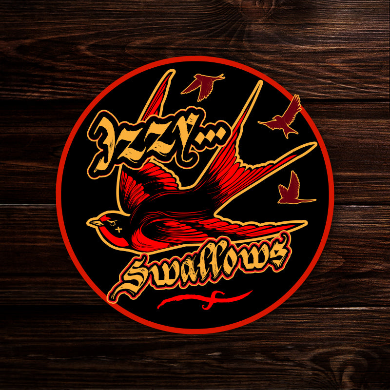 A sticker depicting red birds on a black background. Gold text says "Izzy... swallows"