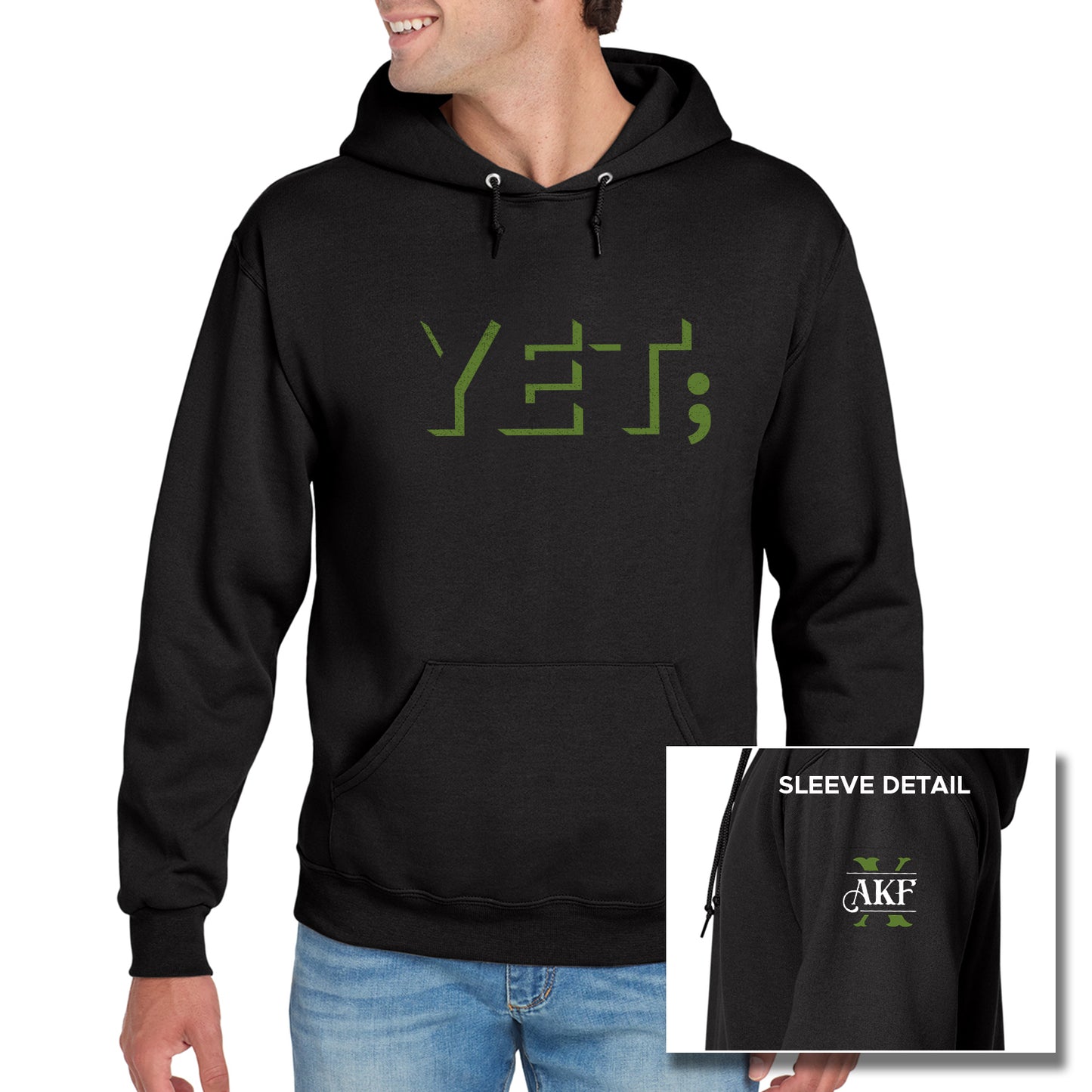 A male model wearing a black hooded pullover sweatshirt. On the front of the sweatshirt is the word "yet" in green block letters, with a semicolon at the end. An inset image of the left sleeve is at the bottom right corner. showing a large green X with the letters AKF above it on white.