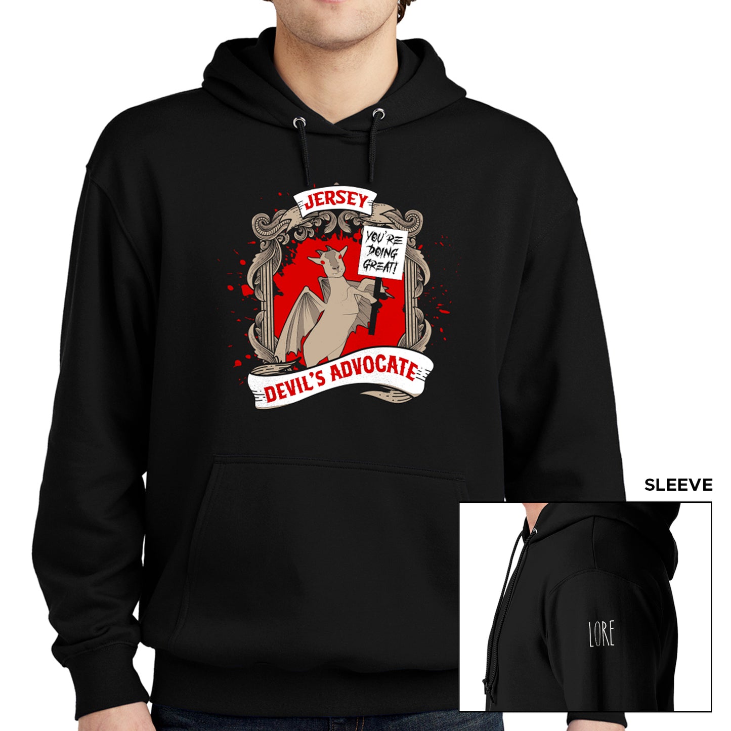 A male model wears a black hoodie sweatshirt with an illustration of a jersey devil goat holding up a sign that says "You're doing great!" along with a title adorning it that says "Jersey Devil's advocate. The left shoulder has the word LORE written in white.