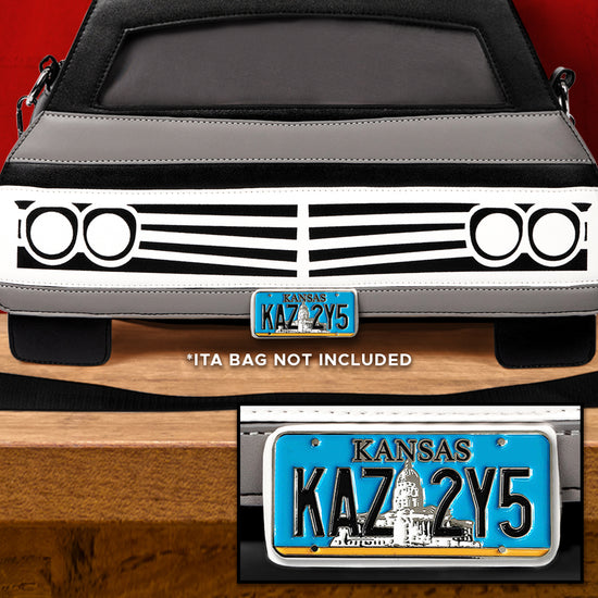 An image of the brown, grey, and white Impala-shaped Ita messenger. bag, with a license plate-shaped. pin on the front. The plate is blue with a slim silver-white outline and reads KANSAS / KAZ 2Y5. The image reads "Ita bag not included".