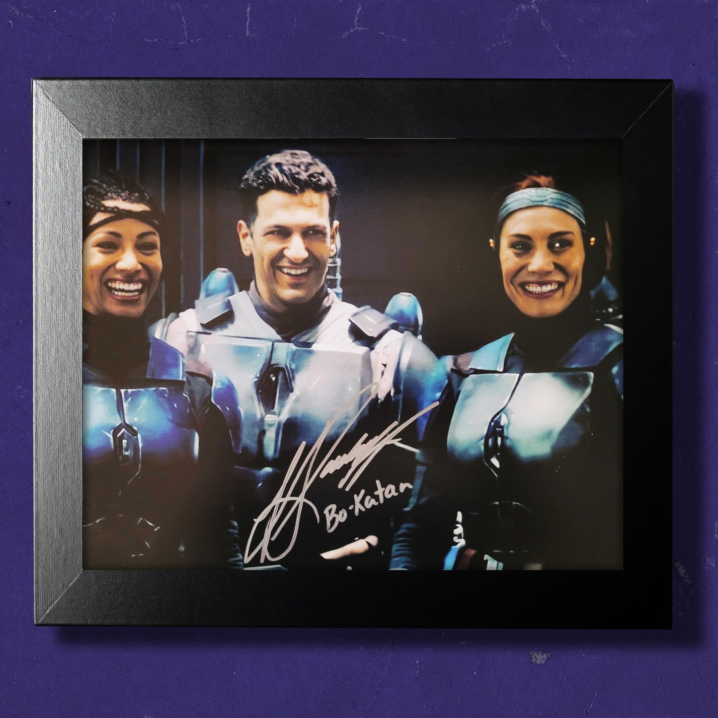 A framed behind the scenes image from The Mandalorian, signed by actor Katee Sackhoff