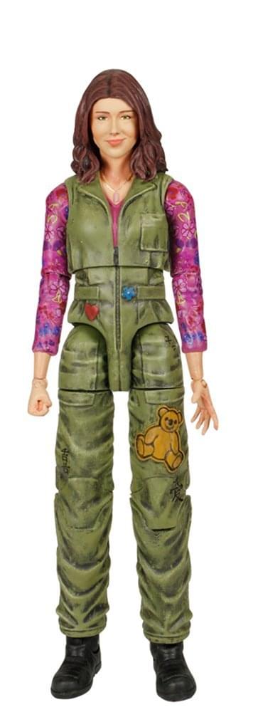 Kaylee Frye action figure in green jumpsuit with colorful sleeves and a teddy bear patch on a white background