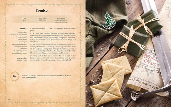A two-page spread from the book. On the left is a parchment-colored page, with a recipe for "Lembas" in black text. On the right is a collection of items from the Lord of the Rings world, including a sword with Elvish characters in the blade, a green cloak, and loaves of Lembas bread tied up in green leaves.