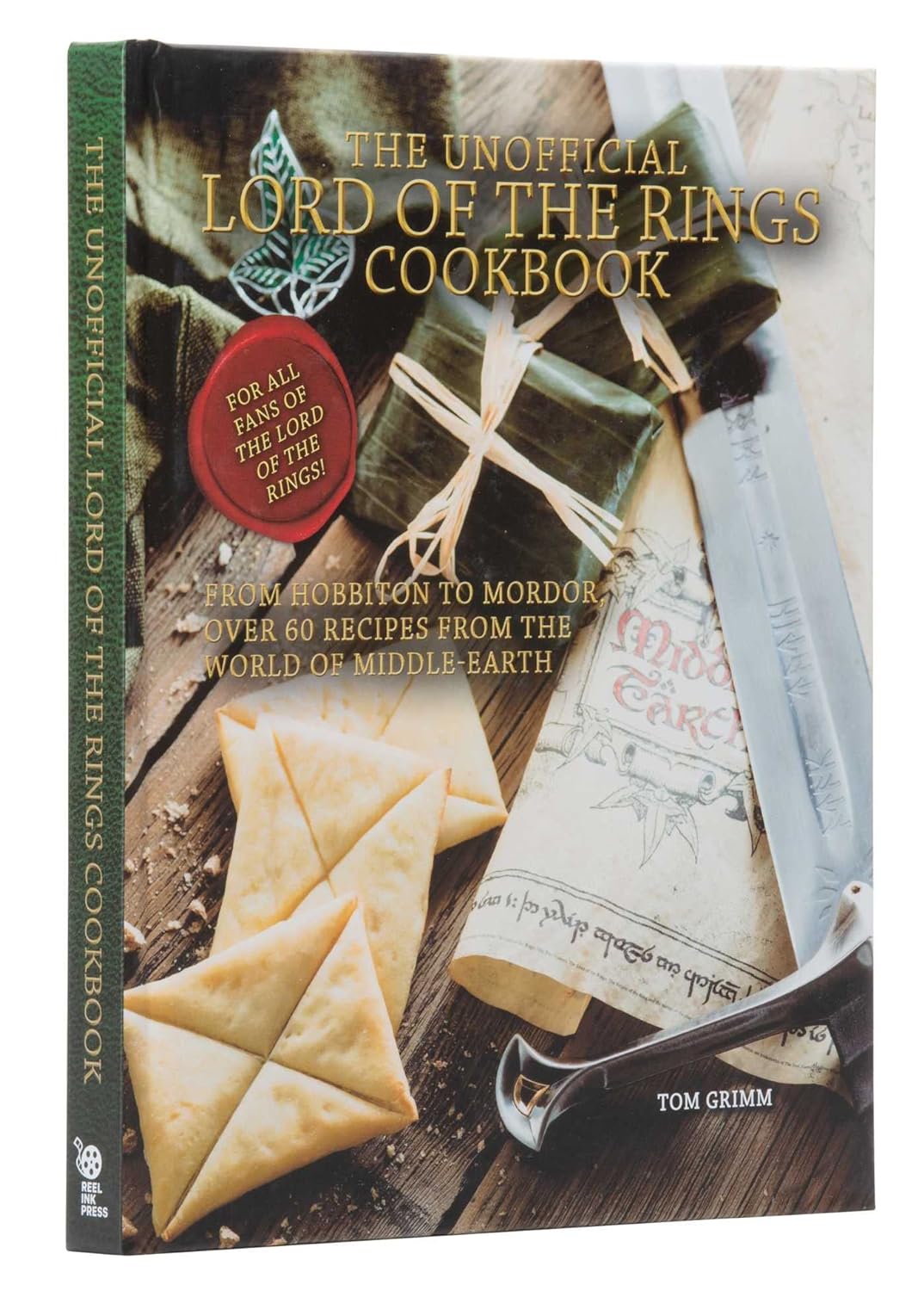A copy of "The Unofficial Lord of the Rings Cookbook". The cover also reads "For all fans of Lord of the Rings" and "From Hobbiton to Mordor: Over 60 Recipes From the World of Middle-Earth - by Tom Grimm". 