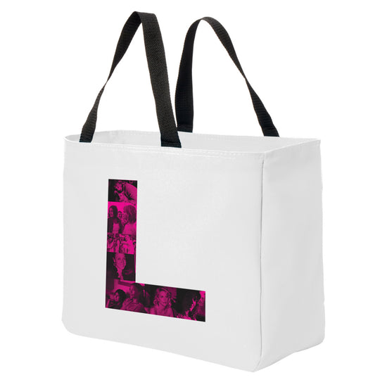 A  white tote bag with black handles against a white background. On the front of the bag is a pink letter L. Inside the L are pink and black images of characters from the TV series The L Word.