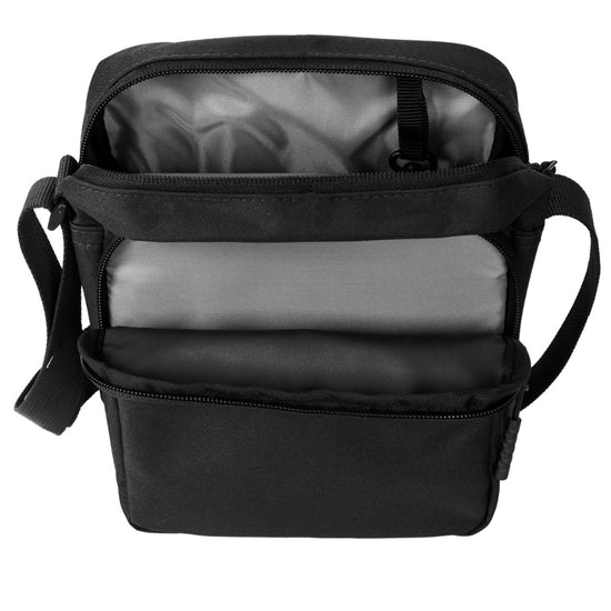 A black blue cross-body bag on a white background, opened to show the inside pockets.