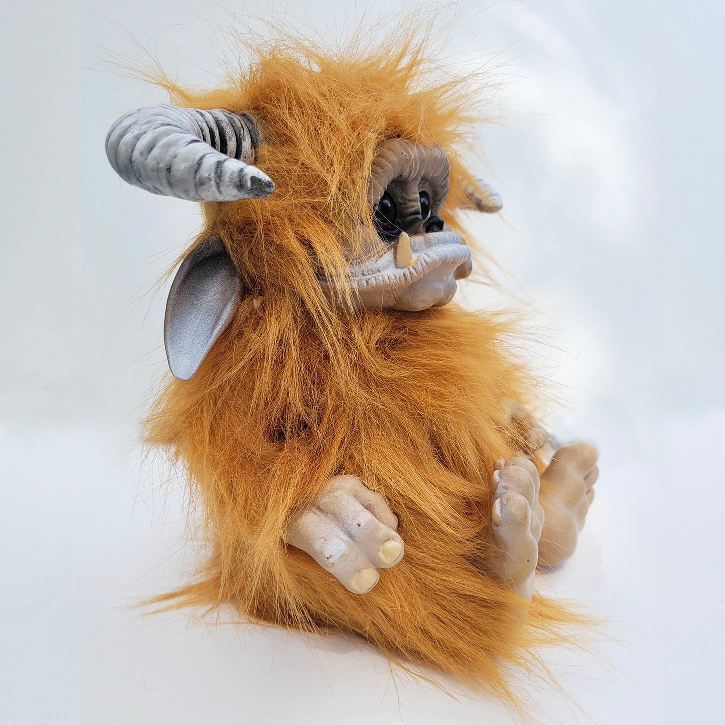 Side view of a plushie depicting the character Ludo from the movie "Labyrinth."