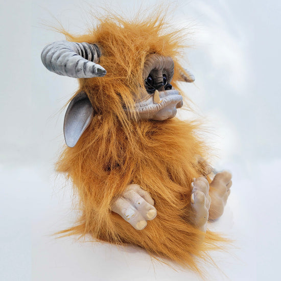 Side view of a plushie depicting the character Ludo from the movie "Labyrinth."