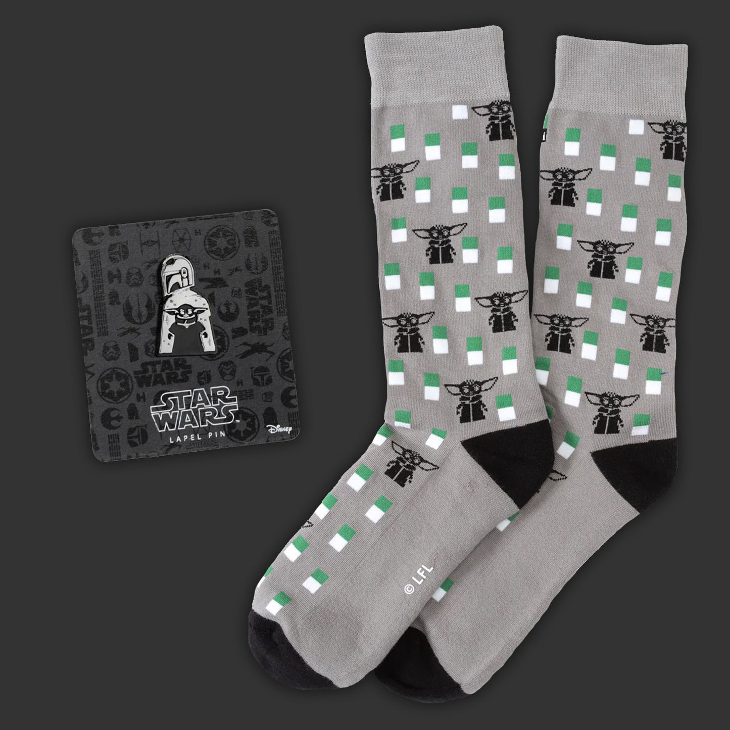 Gray socks with black and green pattern and 'Star Wars' label on a dark background