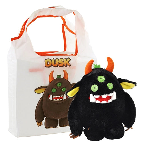 An image of a black plushie against a white background. The plushie has three green eyes, white fangs, and orange horns on the top of its head. Sticking out the sides of the plushie's head are black ears with yellow insides.  At the end of its long arms are brown fingers. Next to the plushie is a white bag with a drawing of the plushie on the front. Orange text says the plushie's name, "Dusk."