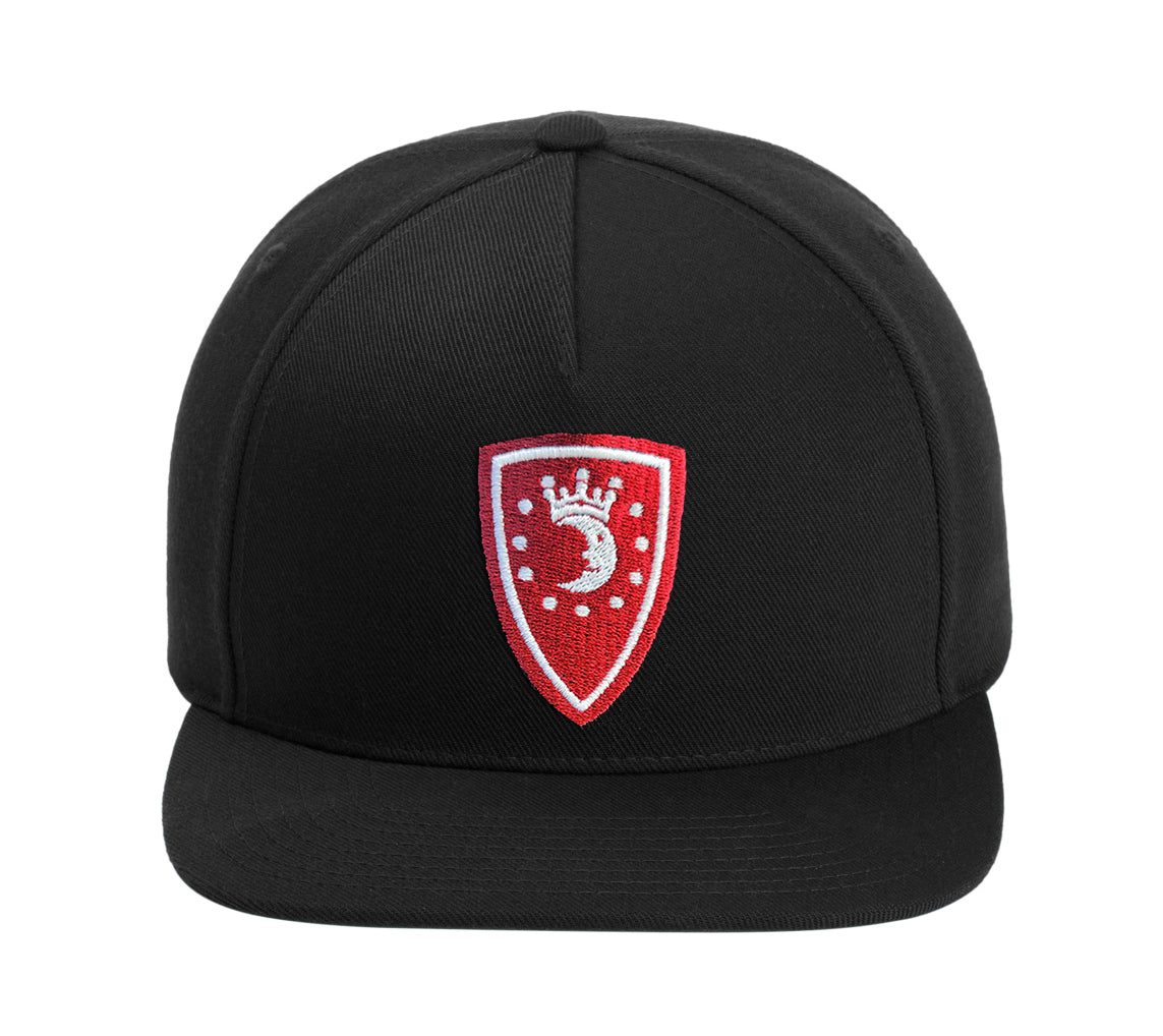 Black cap with a red and white emblem on a white background. The emblem depicts a white crescent moon wearing a crown, with white dots around it in a circle, against a red shield-shaped background.