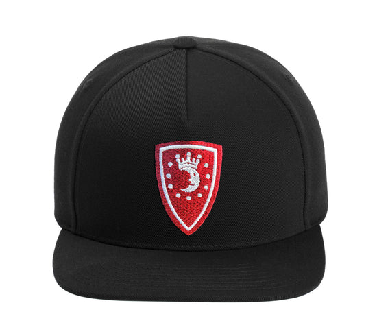 Black cap with a red and white emblem on a white background. The emblem depicts a white crescent moon wearing a crown, with white dots around it in a circle, against a red shield-shaped background.