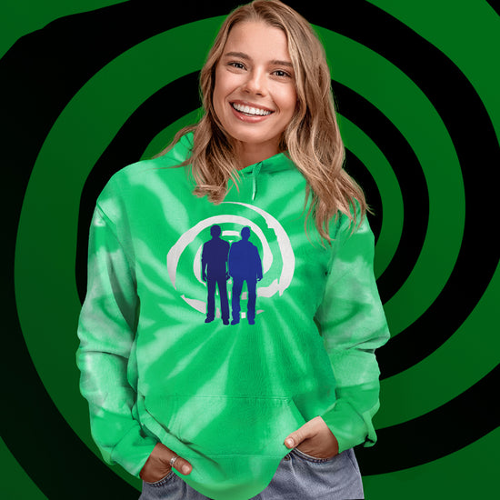 A female model wearing a green tie-dye hooded sweatshirt, in front of a green and black spiral. On the front is a blue silhouette of Sam and Dean Winchester, standing on front of a white spiral. 