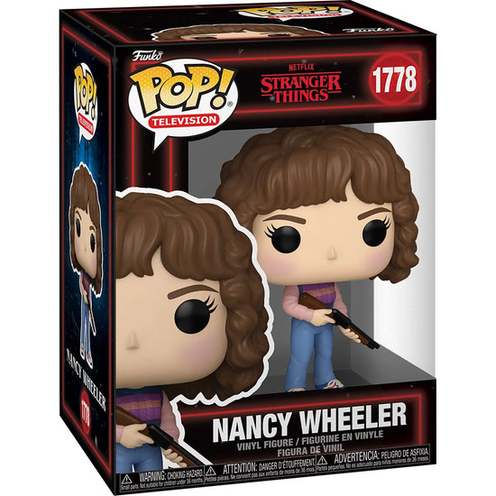 A cardboard box with a transparent front, containing a bobblehead figure depicting Nancy Wheeler from the TV series Stranger Things. She is wearing jeans and a striped sweater, and carrying a shotgun.