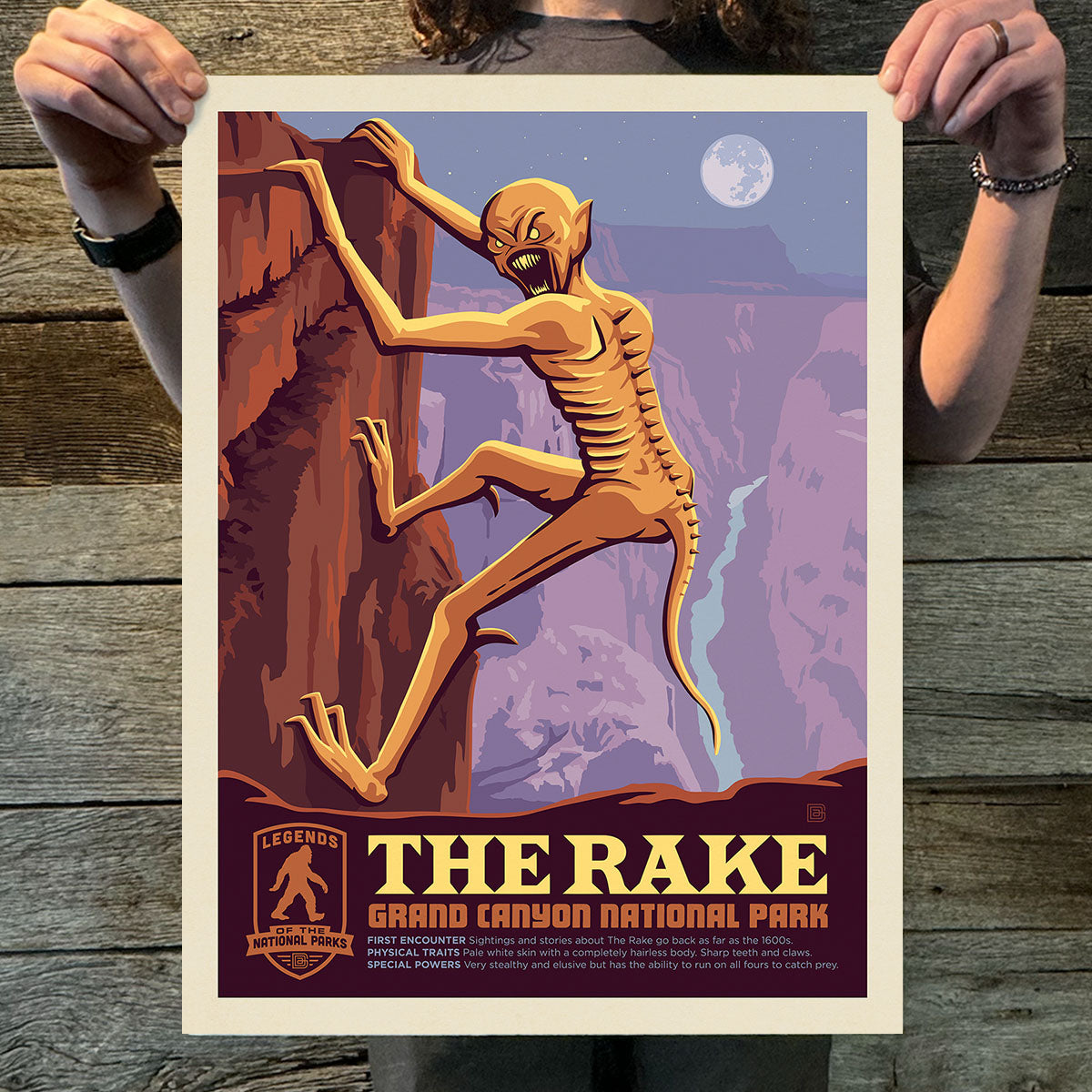 Poster of an alien-like creature climbing a rock formation with 'The Rake' and 'Grand Canyon National Park' text.