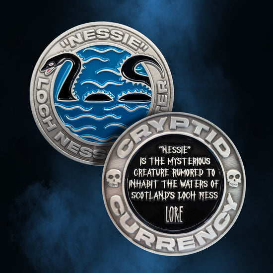 Front and back images of a brass coin on a blue and black background. On the front of the coin is a blue and black drawing of the Loch Ness Monster, with "nessie" stamped into the coin's edge. On the back of the coin is a black circle, with white text saying "nessie is the mysterious creature rumored to inhabit the waters of scotland's lock ness: Lore." Around the edge is stamped text saying "cryptid currency."
