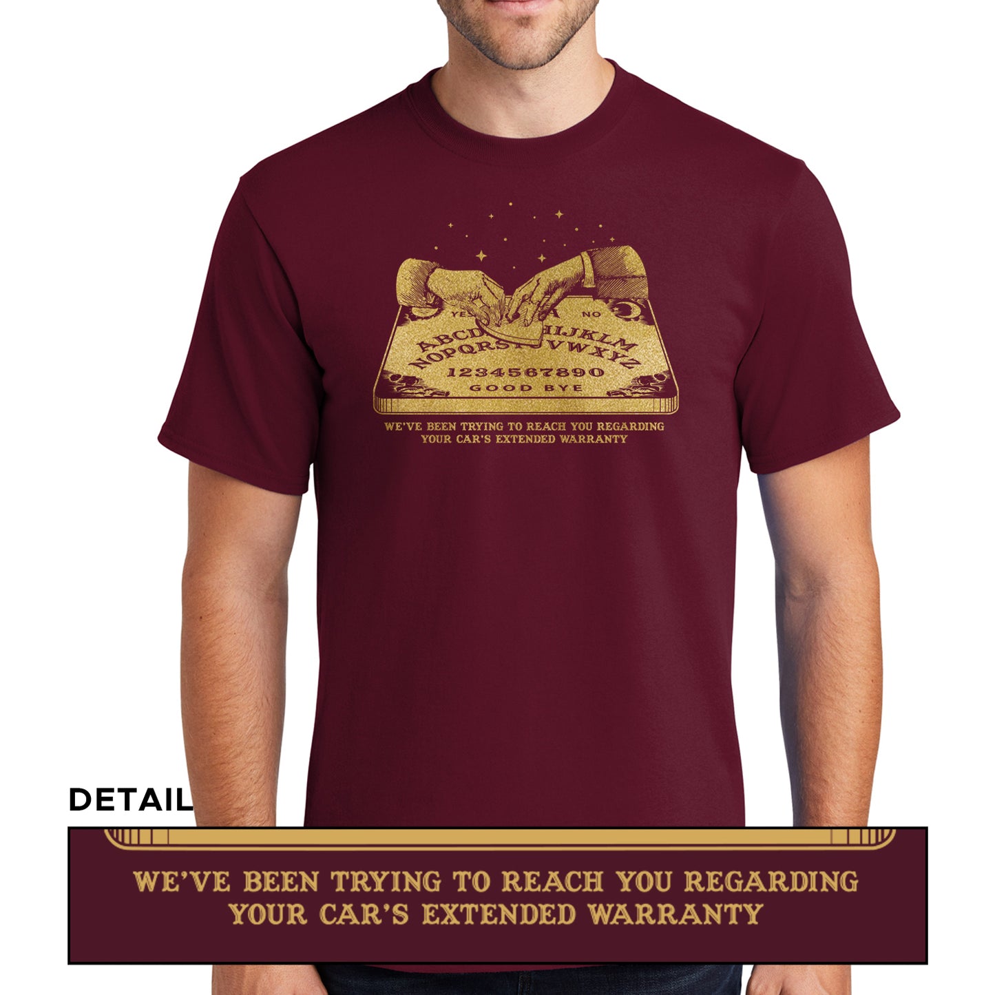 A male model wearing a maroon T-shirt, with a gold color image of two hands over a Ouija board. Under the board is gold text saying "We've been trying to reach you regarding your car's extended warranty." A second, smaller image is at the bottom, showing a close-up of the text.