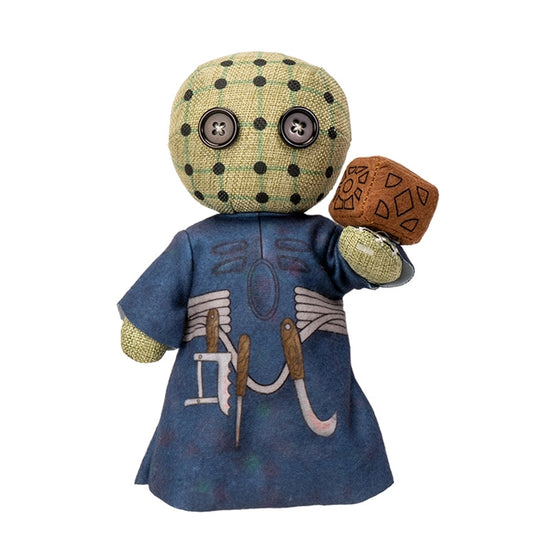 Stuffed toy with a polka dot head and blue outfit on a white background