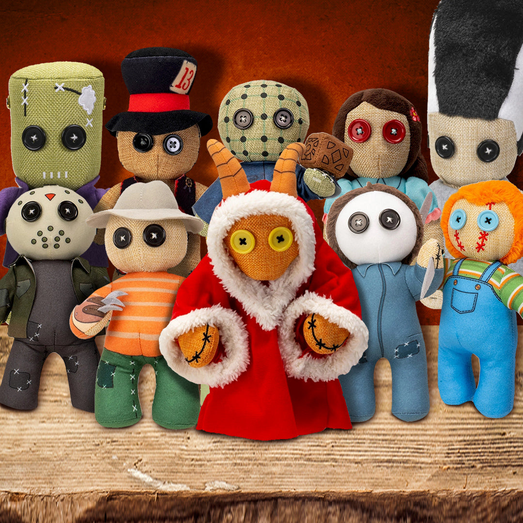 A collection of stuffed dolls on a wooden plank. Each doll depicts a famous horror character.