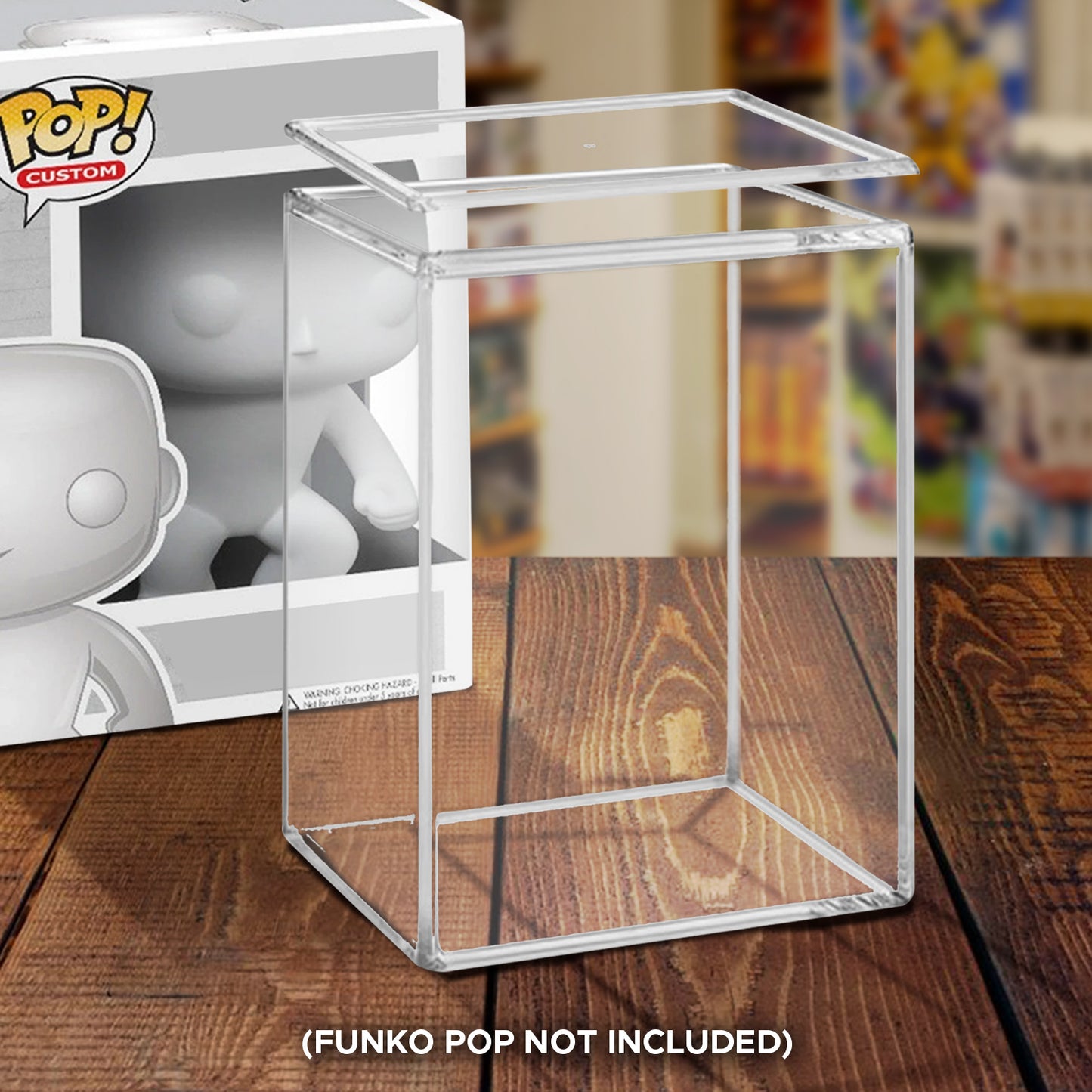 Clear acrylic display case on a wooden surface with Funko Pop! packaging in the background.