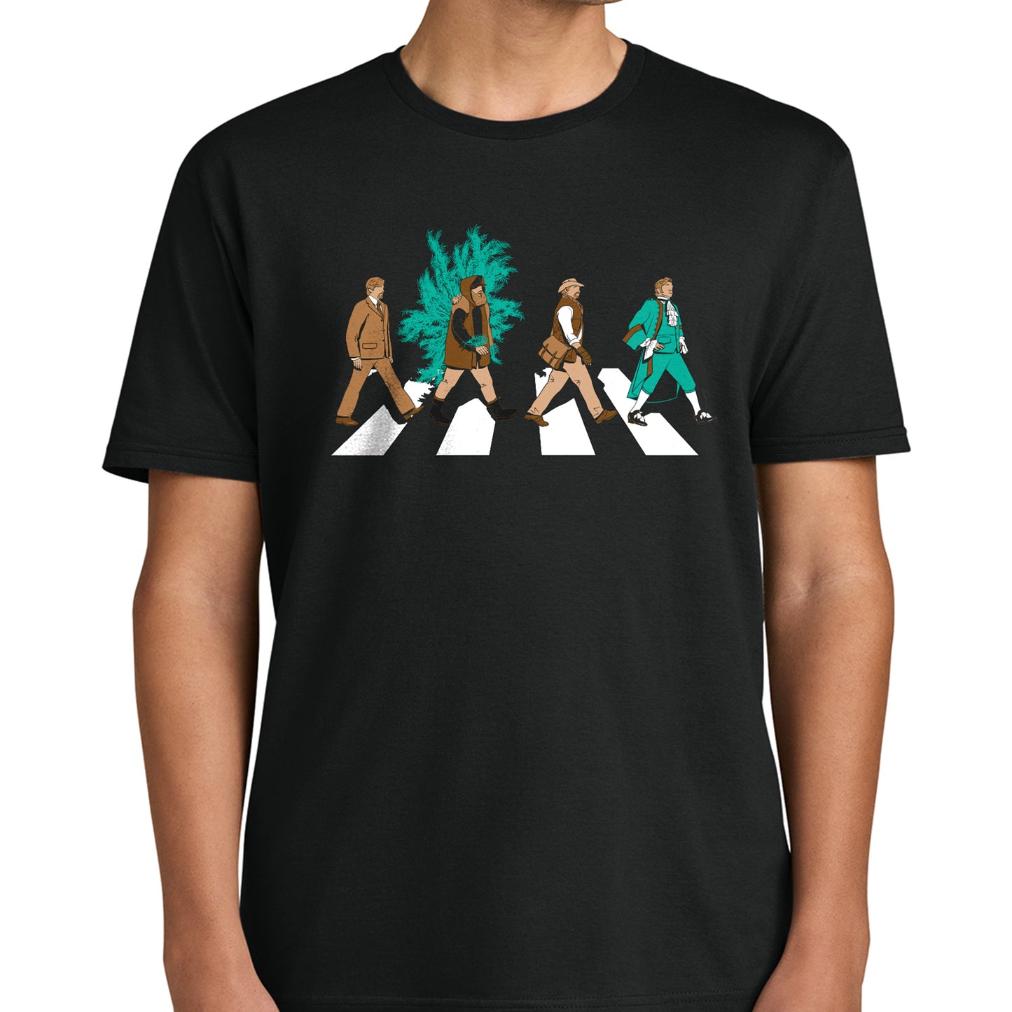 A model wearing a black t-shirt. On the front are four characters crossing a street, mimicking the iconic Beatles Abbey Road image