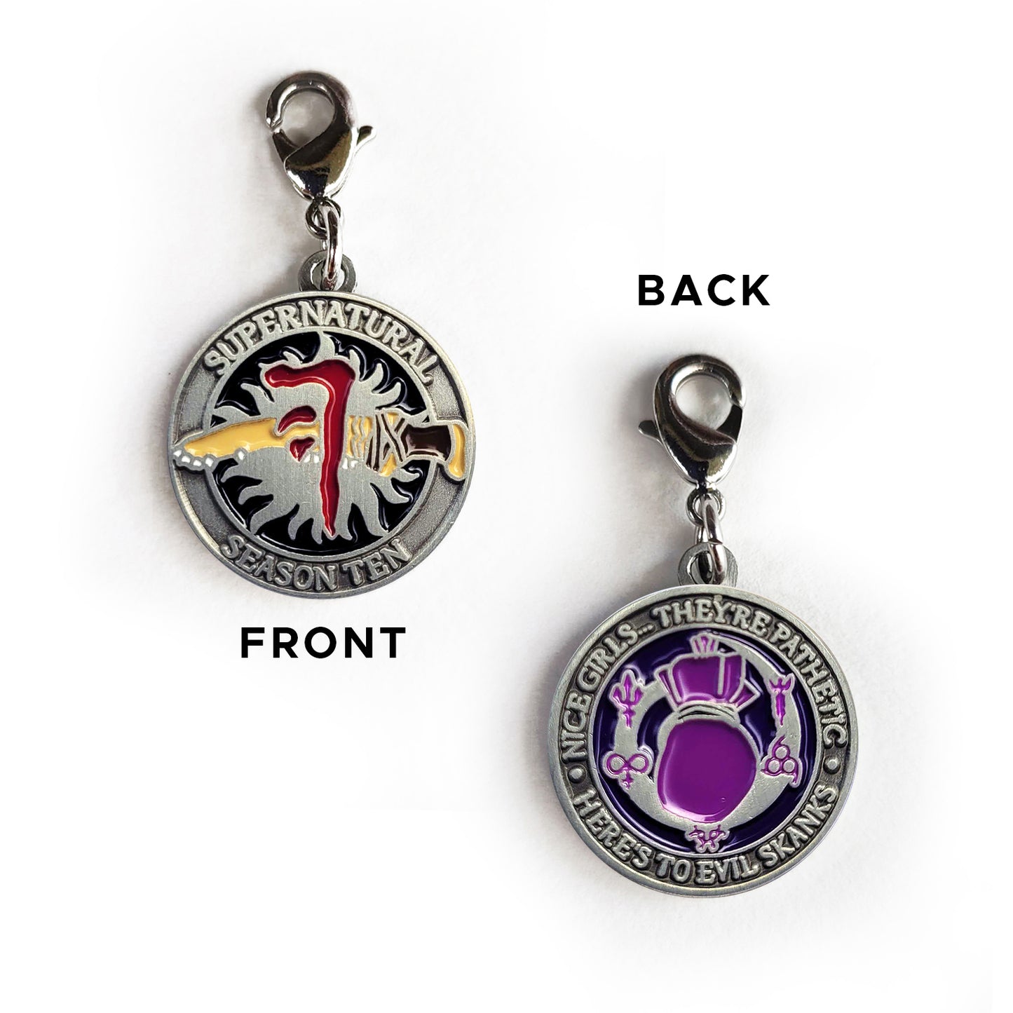A brass coin with "Supernatural season ten”, The front has a black background, and the anti-possession symbol with a knife piercing it, with the Mark of Cain on top. The back has “Nice’ girls… they’re pathetic. Here’s to evil skanks” printed around the edge.”, and a purple spell bag with spell symbols surrounding it.