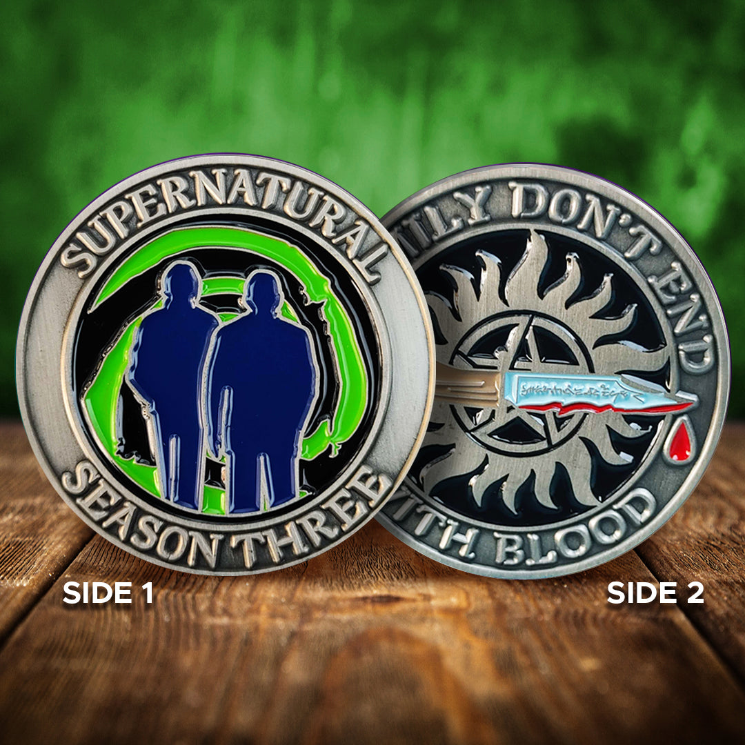 Load image into Gallery viewer, A brass coin with &amp;quot;Supernatural season three&amp;quot;, a green &amp;quot;Mystery Spot&amp;quot; swirl, and 2 male sillhouettes on one side and &amp;quot;Family Don&amp;#39;t End With Blood&amp;quot; with a knife and anti-possession symbol on the other
