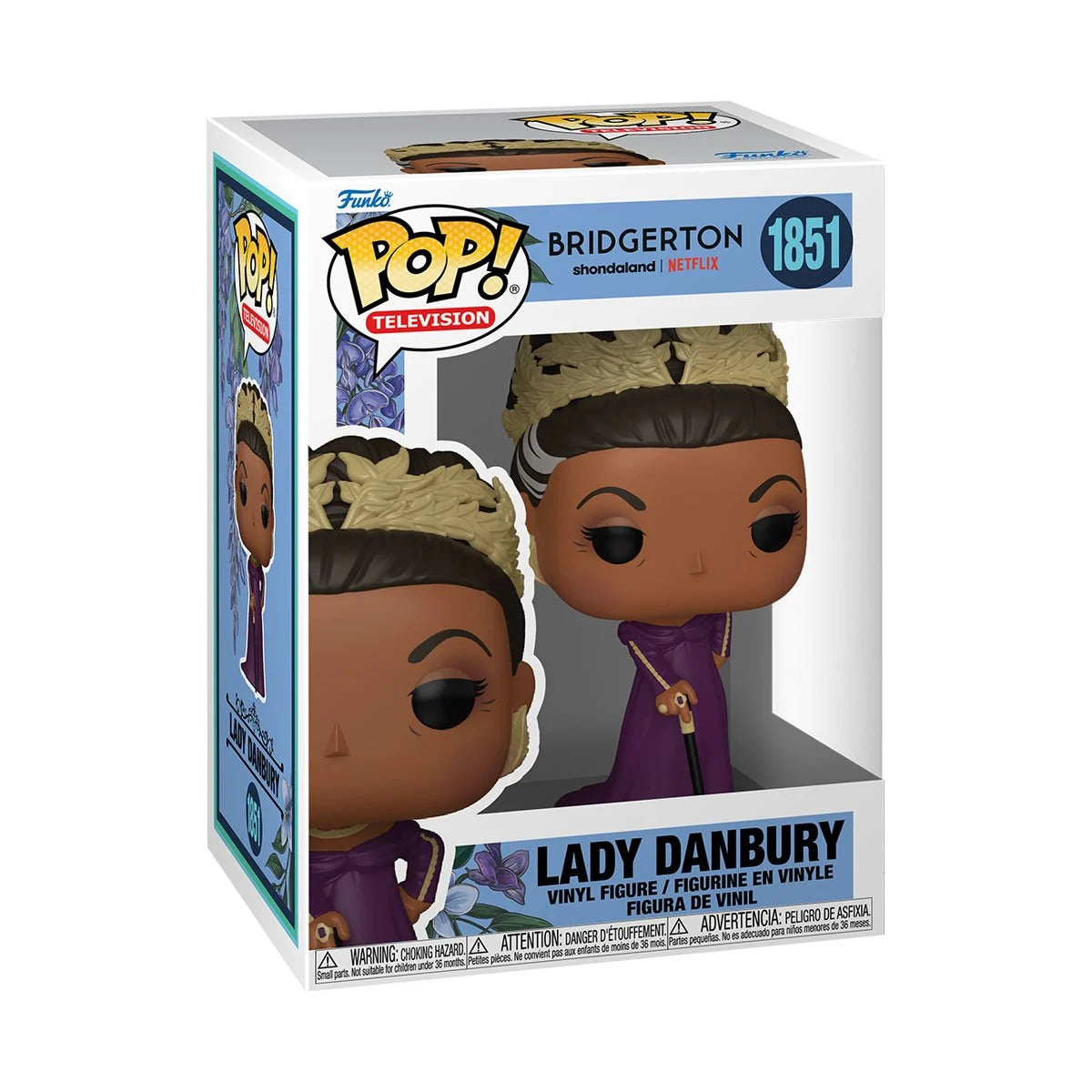 A cardboard box with a transparent front, containing a bobblehead figure depicting Lady Danbury, wearing a purple gown and a golden crown. She is carrying a walking stick in one hand.