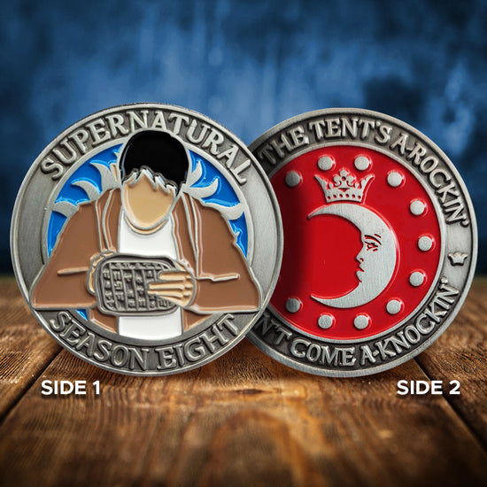 A brass coin charm with "Supernatural season eight", a blue background, and a sillhouette of Kevin Tran with a tablet on one side, and "When the tent's a-rockin', don't come a-knockin'.", and a silver moon and circle of small silver dots against a red background on the other
