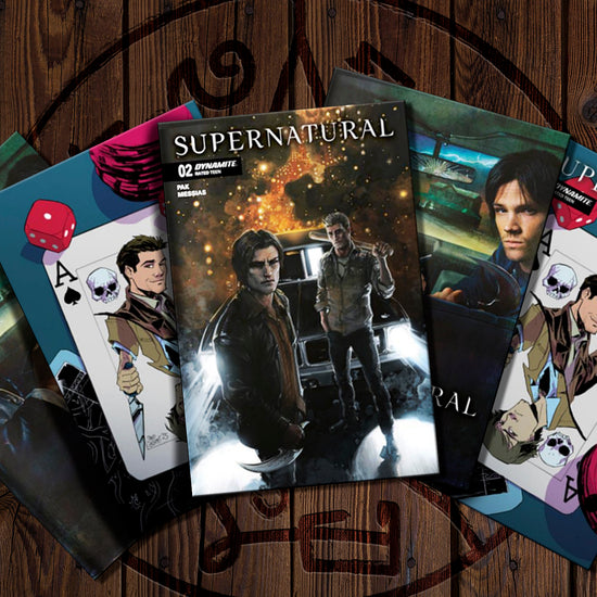 Comic books featuring 'Supernatural' on a wooden surface