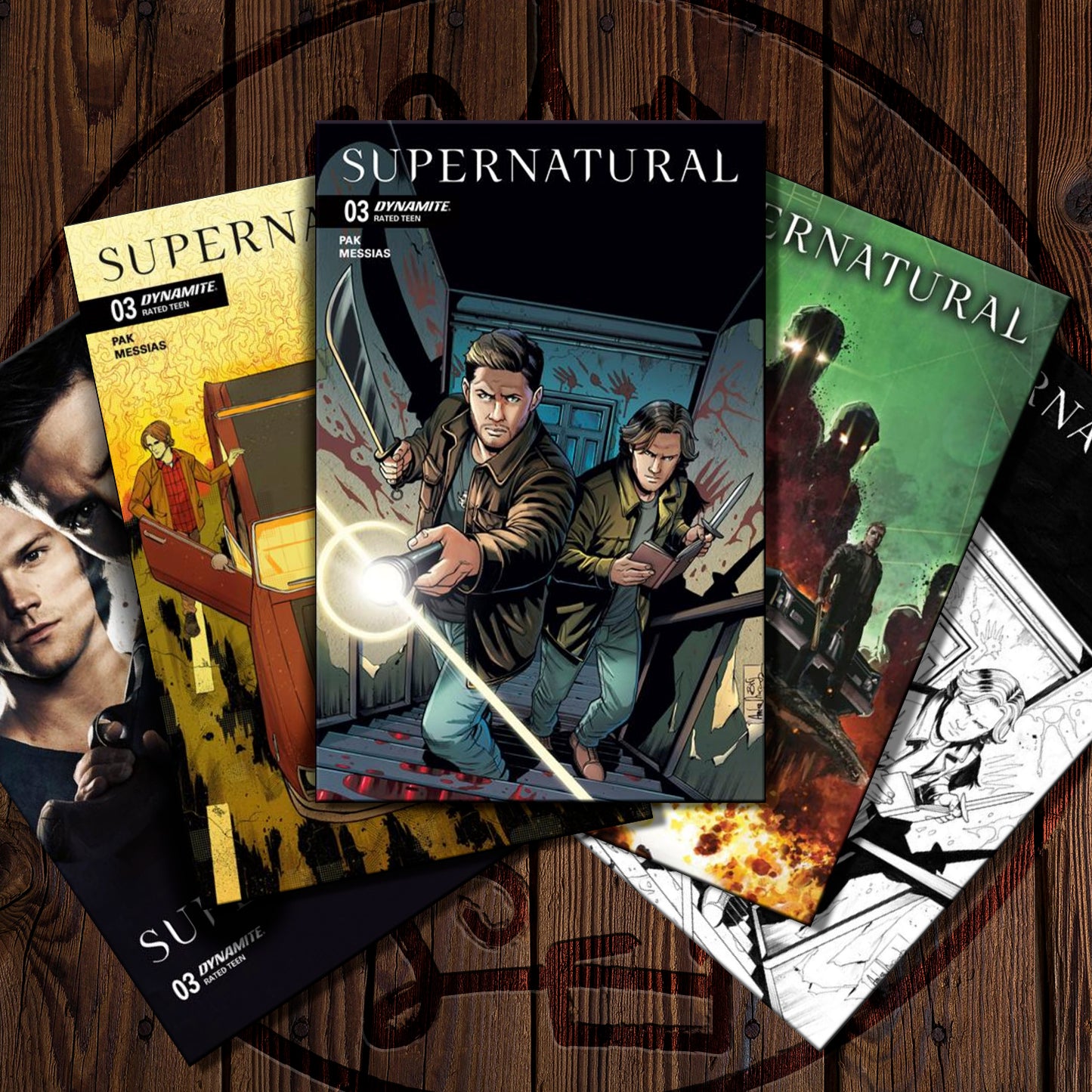 Supernatural comic books on a wooden surface