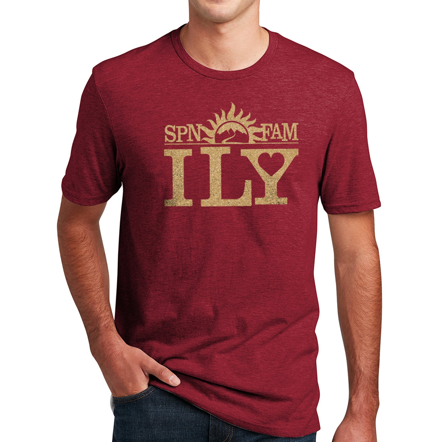 A male model in a dark red T-shirt. The shirt has gold text that says SPN FAM across the top, with ILY in larger font below. In the center is a rising sun image, with a road leading into the mountains