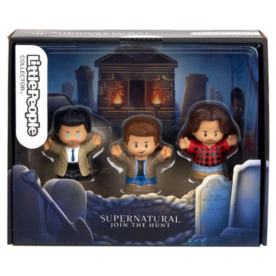 A black cardboard box containing three Little People toy figurines. The figurines depict the characters Sam Winchester, Dean Winchester, and Castiel, from the TV series "Supernatural." The interior of the box depicts a cemetery, with an open grave at the front.